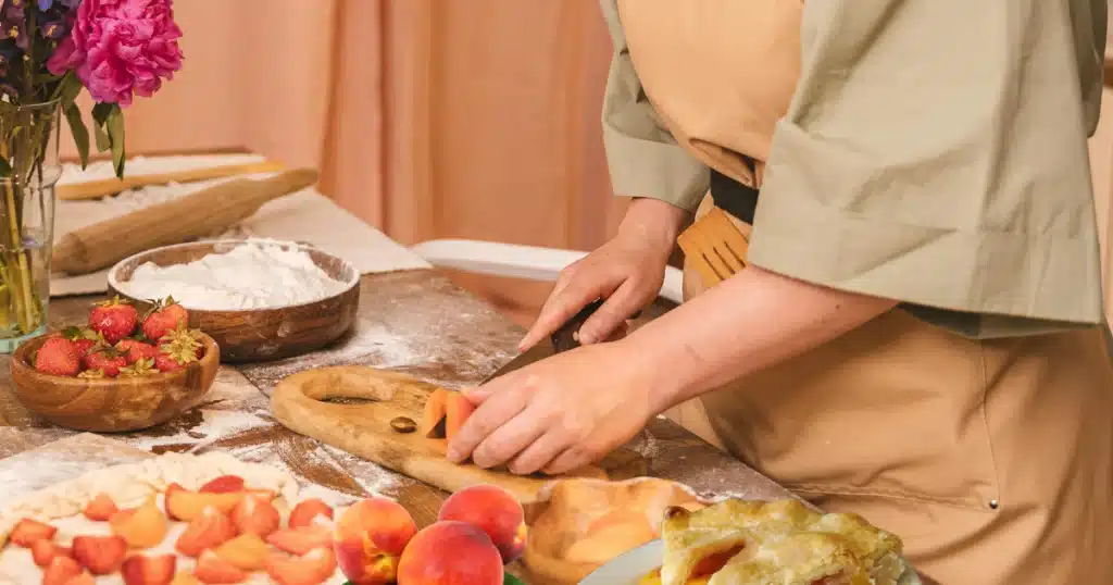 Peach cobbler with cake mix served with a scoop of vanilla ice cream